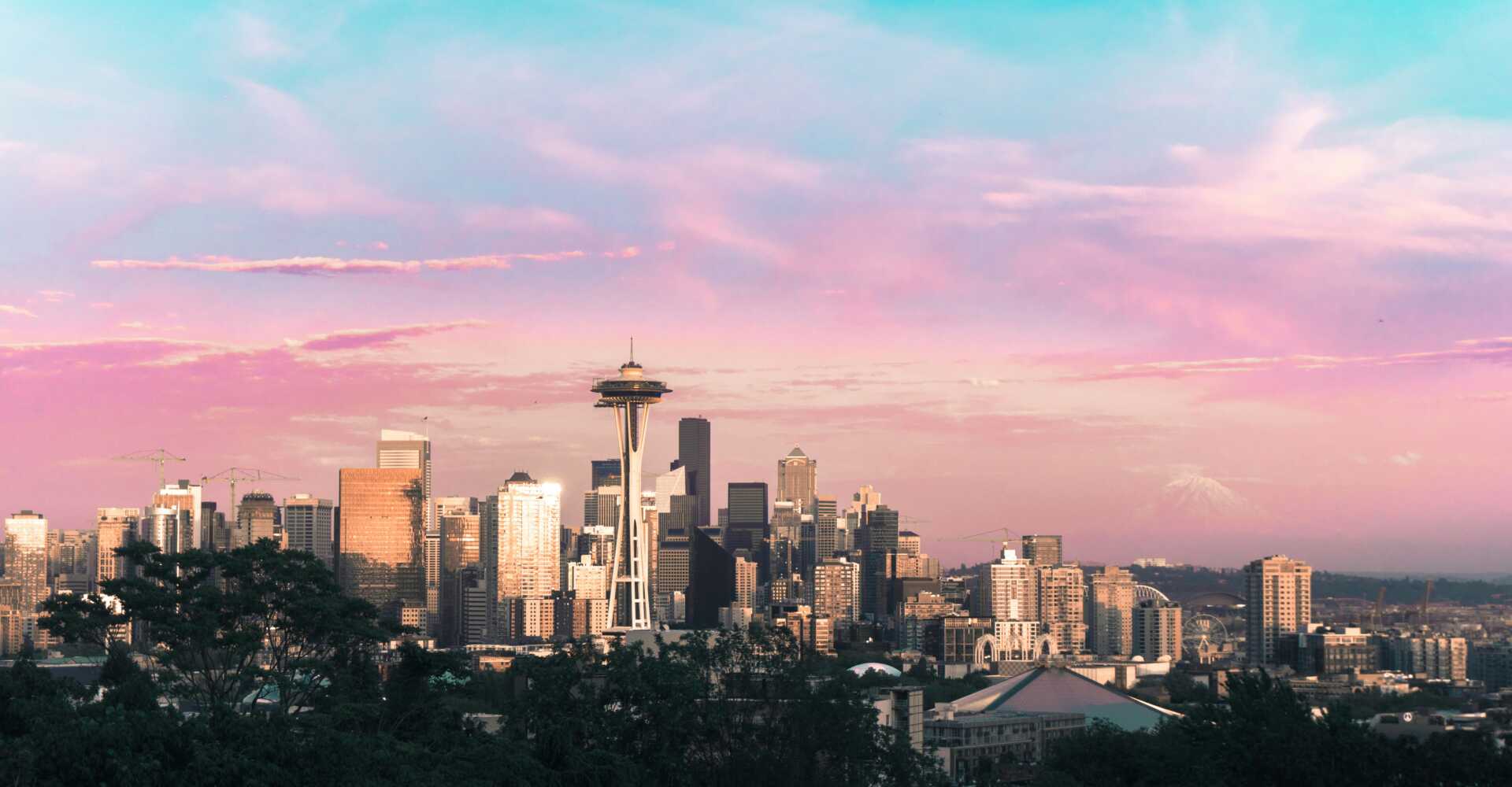 ben dutton insv5BSTqv0 unsplash Seattle skyline against a pink sunset