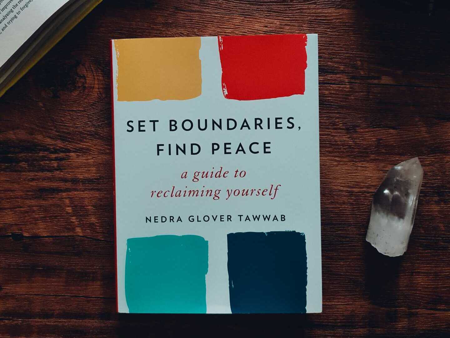 edz norton Br6HpT9fhTM unsplash A book titles "Set Boundaries Find Peace" laying flat on a wooden table