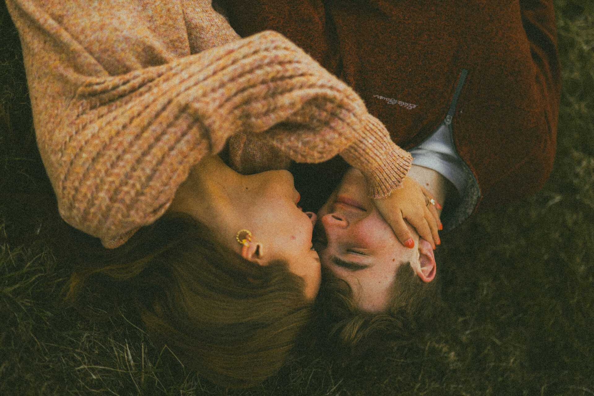 brooke balentine edEXTbShEL0 unsplash A couple laying down and looking into each other's eyes