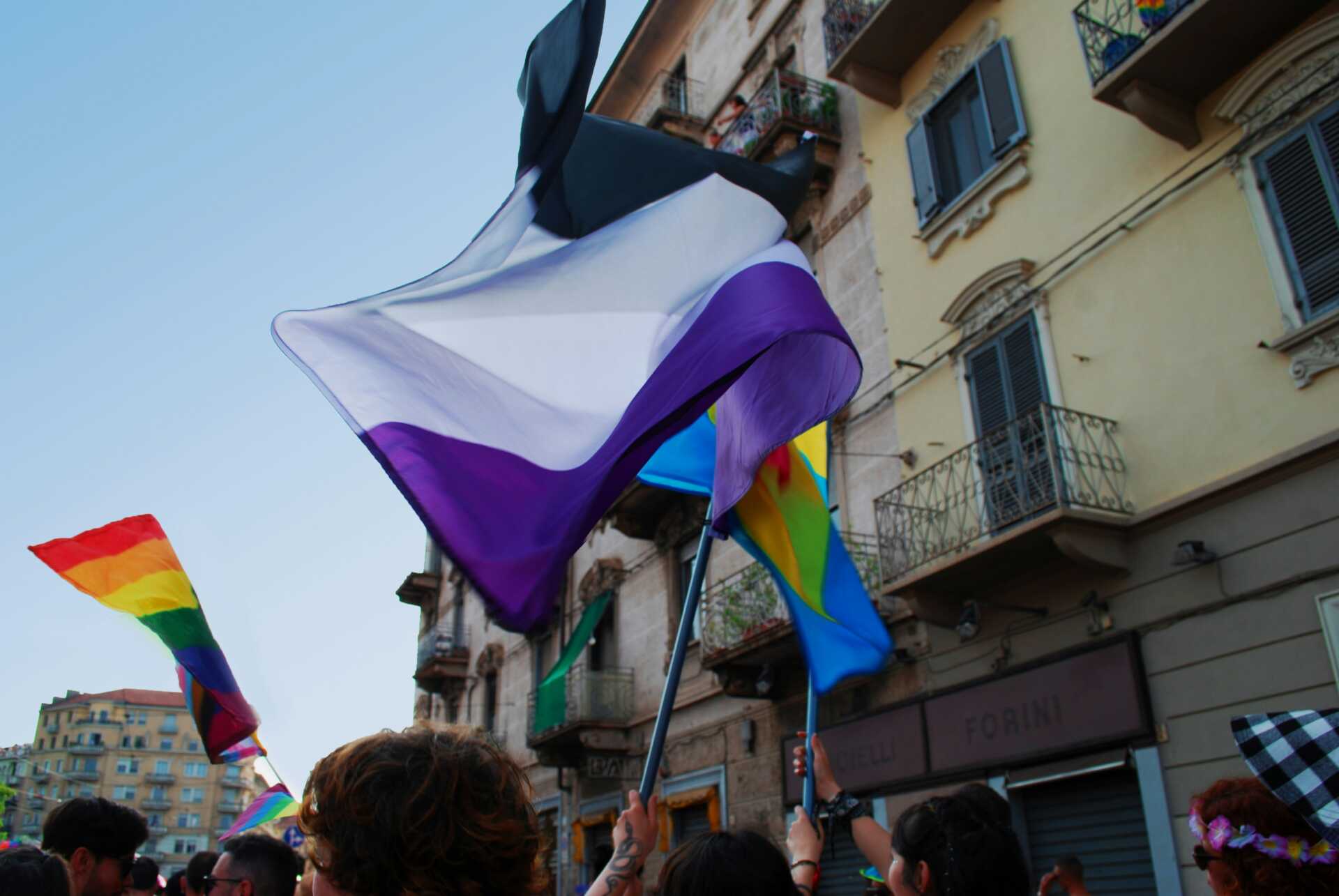 An asexual pride flad being flown at a Pride event