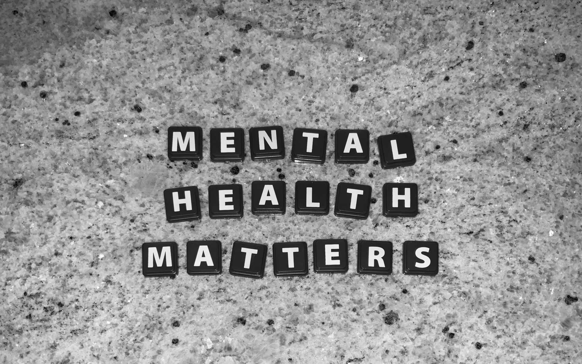 marcel strauss fzqxoFJytiE unsplash black scrabble tiles laid out to spell "Mental Health Matters"