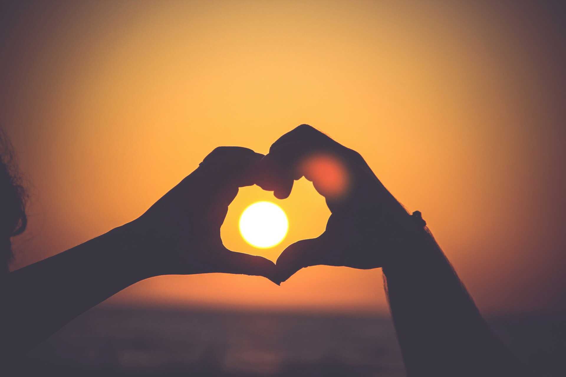 mayur gala 2PODhmrvLik unsplash Two hands making a heart with a sunset centered in the middle