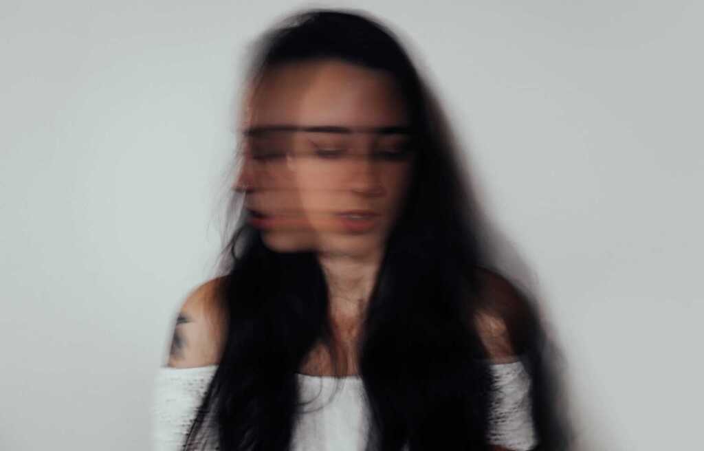 A woman's face blurred