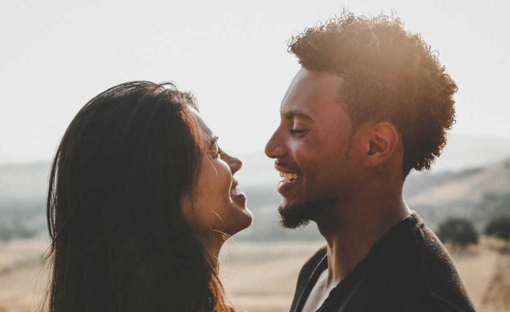 A couple looking at each other and smiling