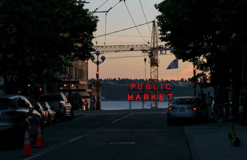 The Pike Place Market sign at sunset
