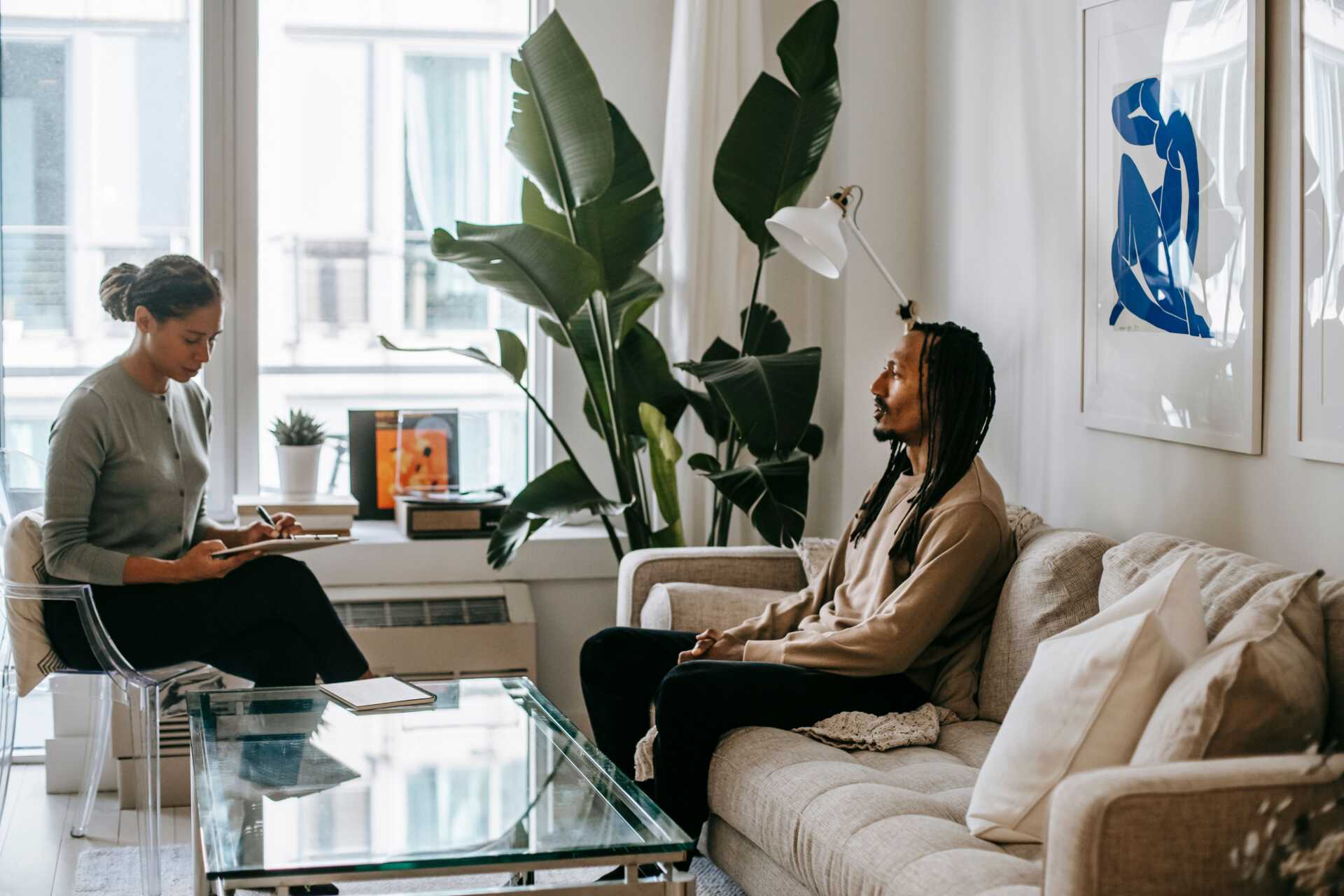 pexels alex green 5700138 A serene therapy session between therapist and client in a cozy, light-filled living room.